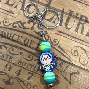 Galactic Explorer Keychain with Blue and Yellow Beads